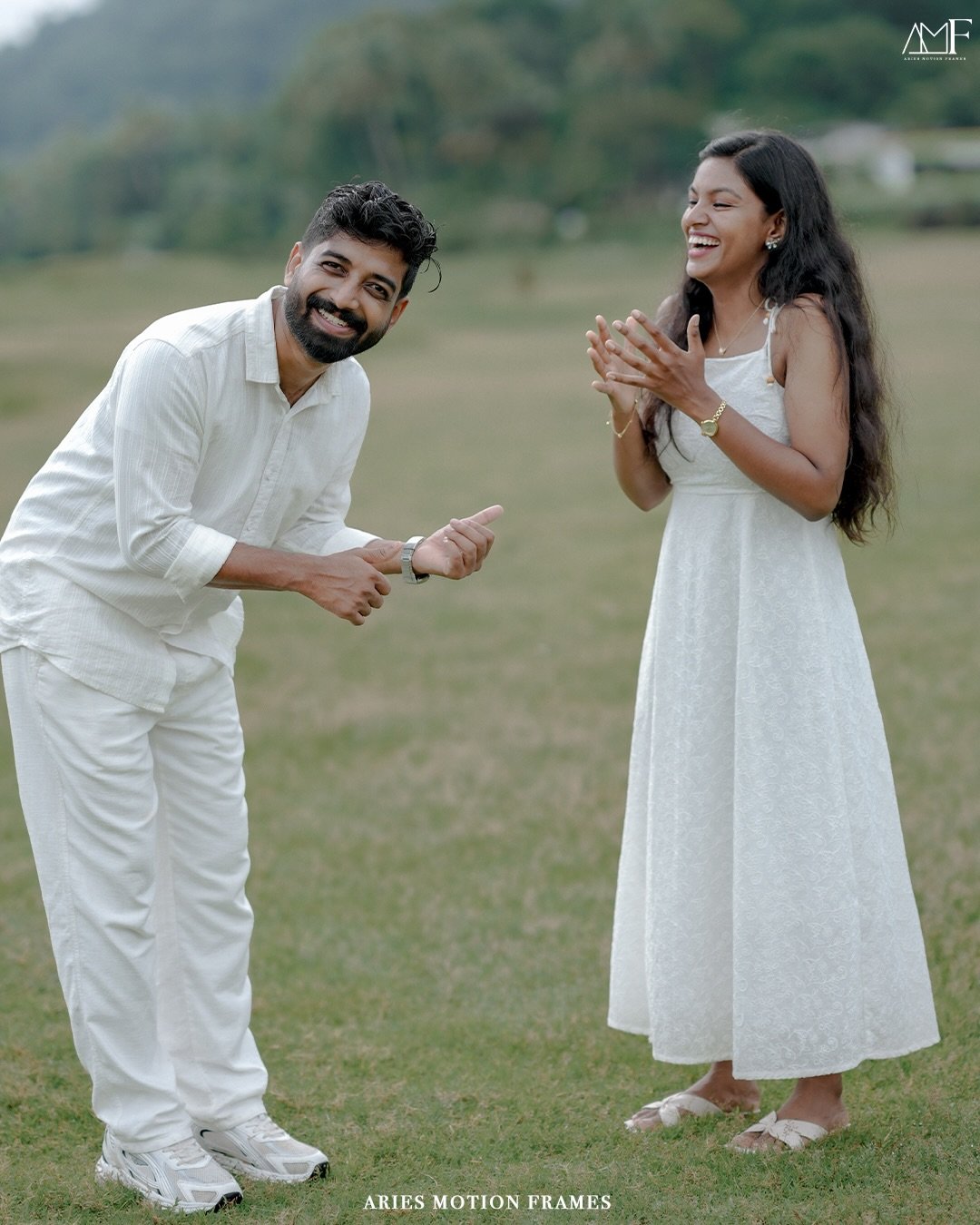 A couple laughing together during a relaxed outdoor portrait